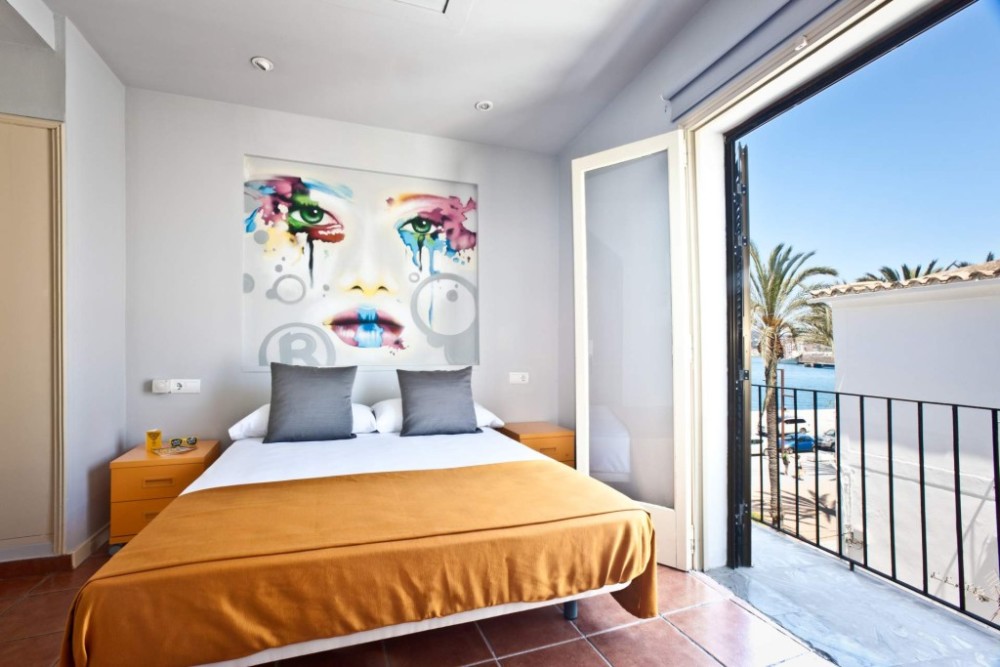 Surf and book in few minutes: Stilish Design Hotel Rooms in Ibiza town | Modern boutique hotel with an exceptional seafront location in Ibiza La Marina neighbourhood. Central position, port views, and friendly and helpful staff. modern boutique-style hotel